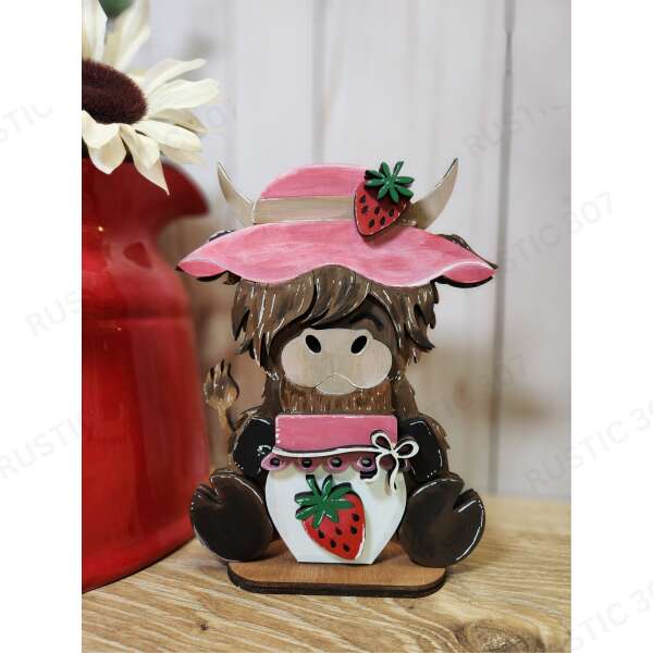 Strawberry picking Highland Cow